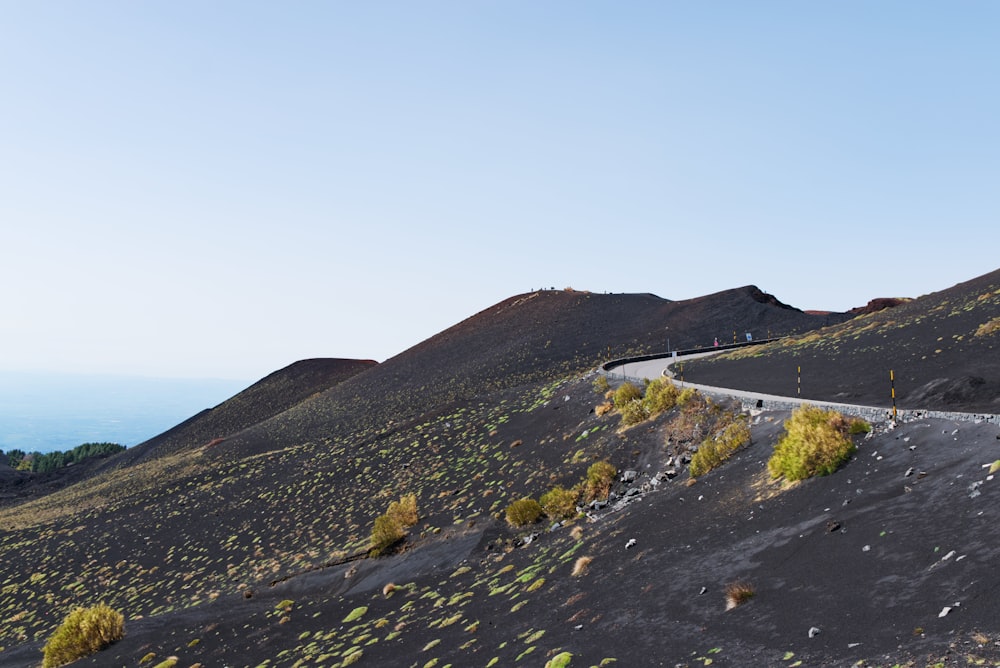 a winding road in the middle of a desert