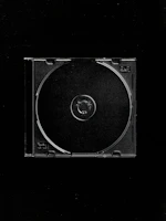 a black and white photo of a cd case