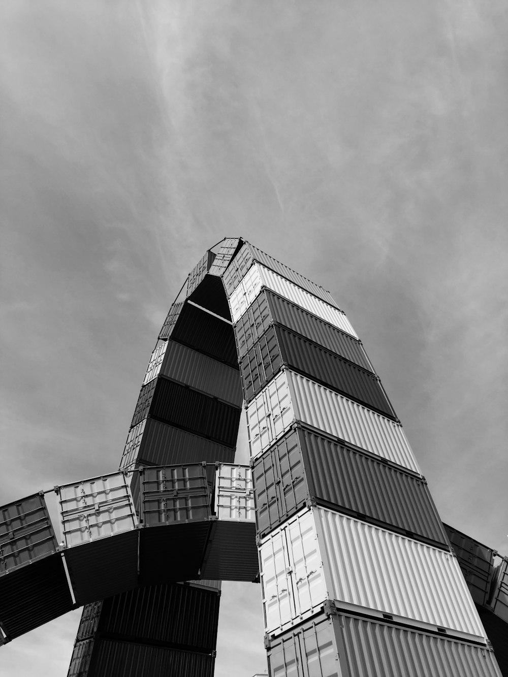 a tall building made out of shipping containers