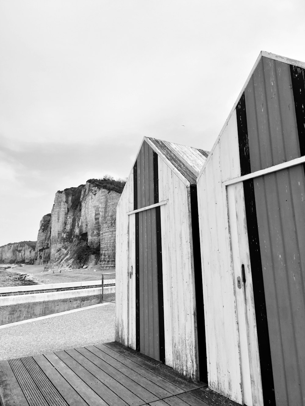 a black and white photo of a wooden deck