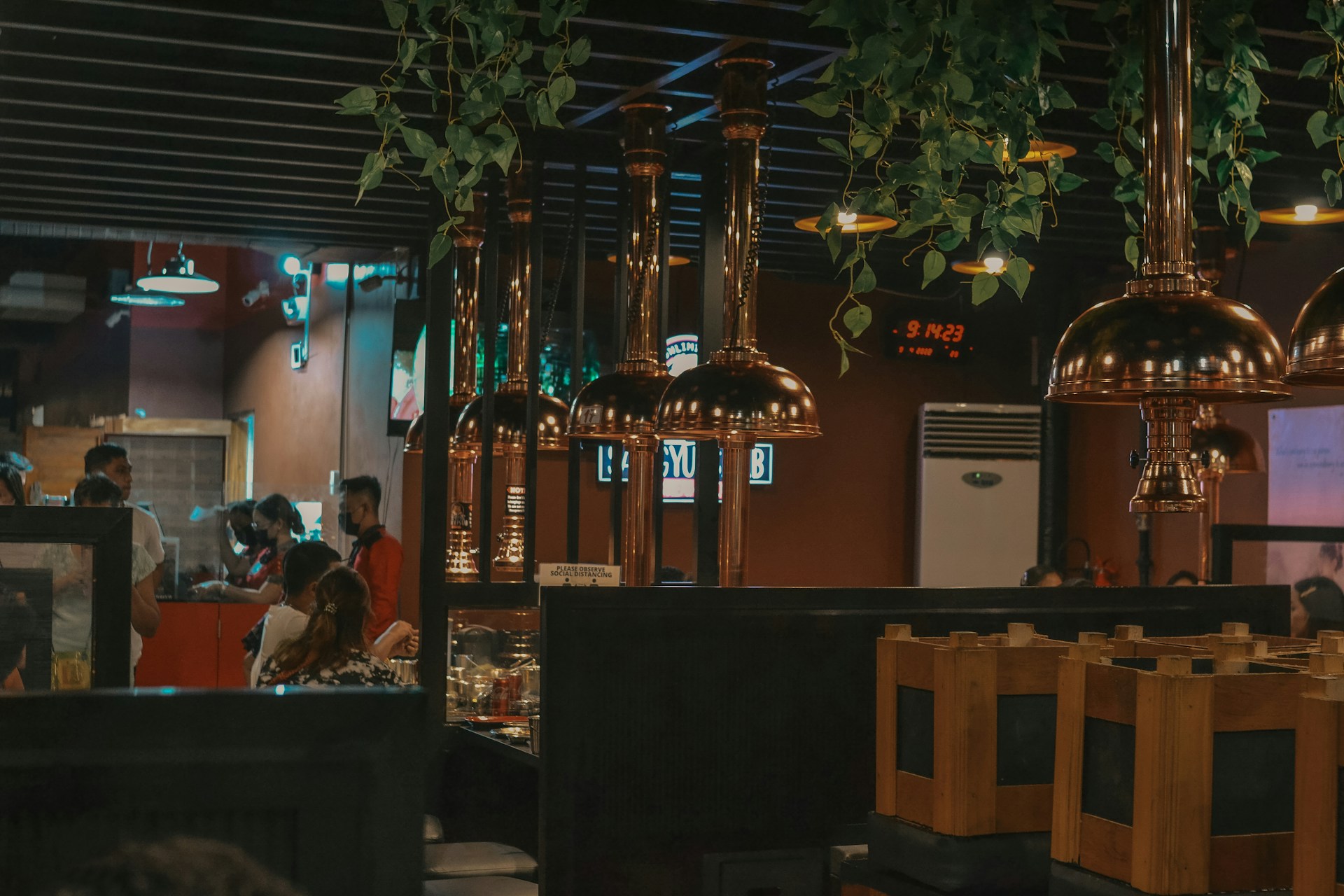 a group of people sitting at a table in a restaurant