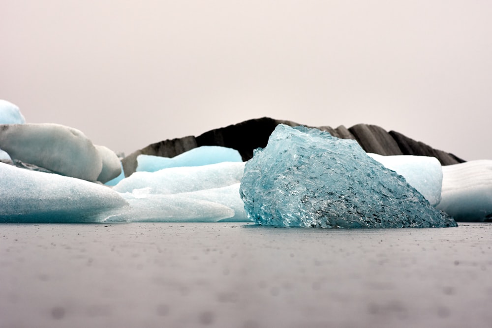 a large iceberg sitting on top of a pile of ice