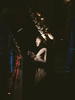 An elegant carving displayed against a minimalist backdrop, highlighting its craftsmanship.