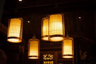 a group of lantern lights hanging from the ceiling