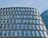 Modern office building facade featuring sleek glass and aluminum panels.