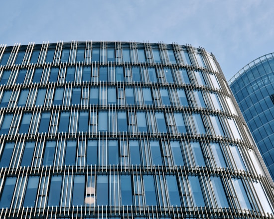 A sleek modern office window featuring sun control film with a subtle blue tint.