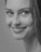 a black and white photo of a woman smiling