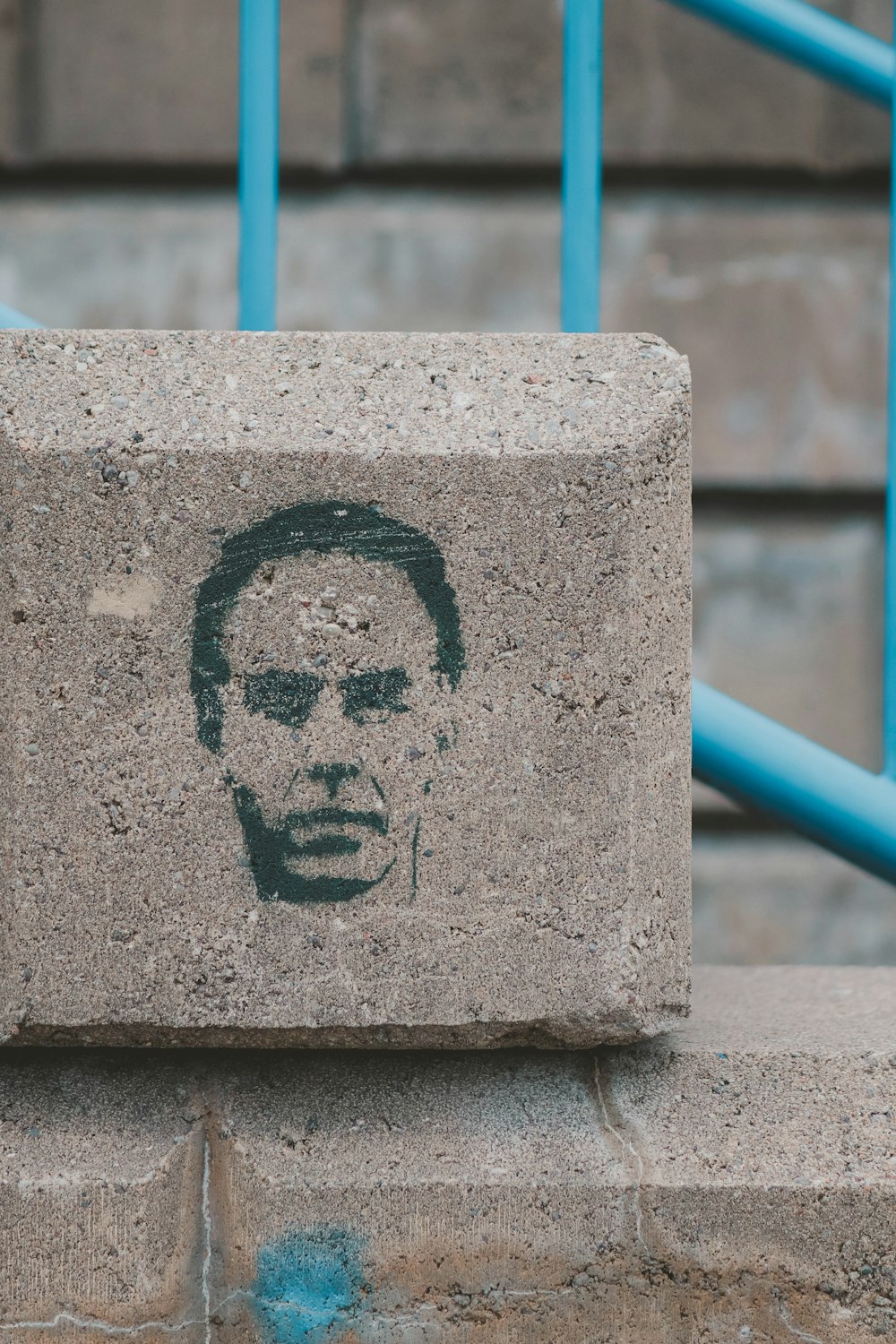 a cement block with a picture of a man on it