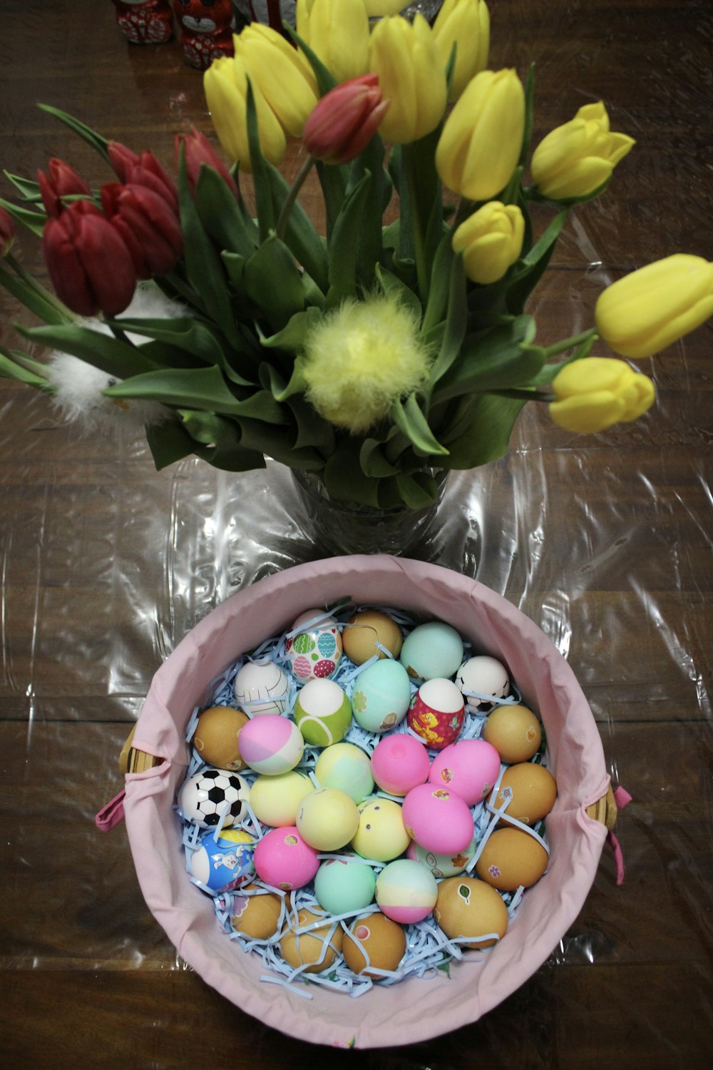 a vase filled with lots of different colored eggs