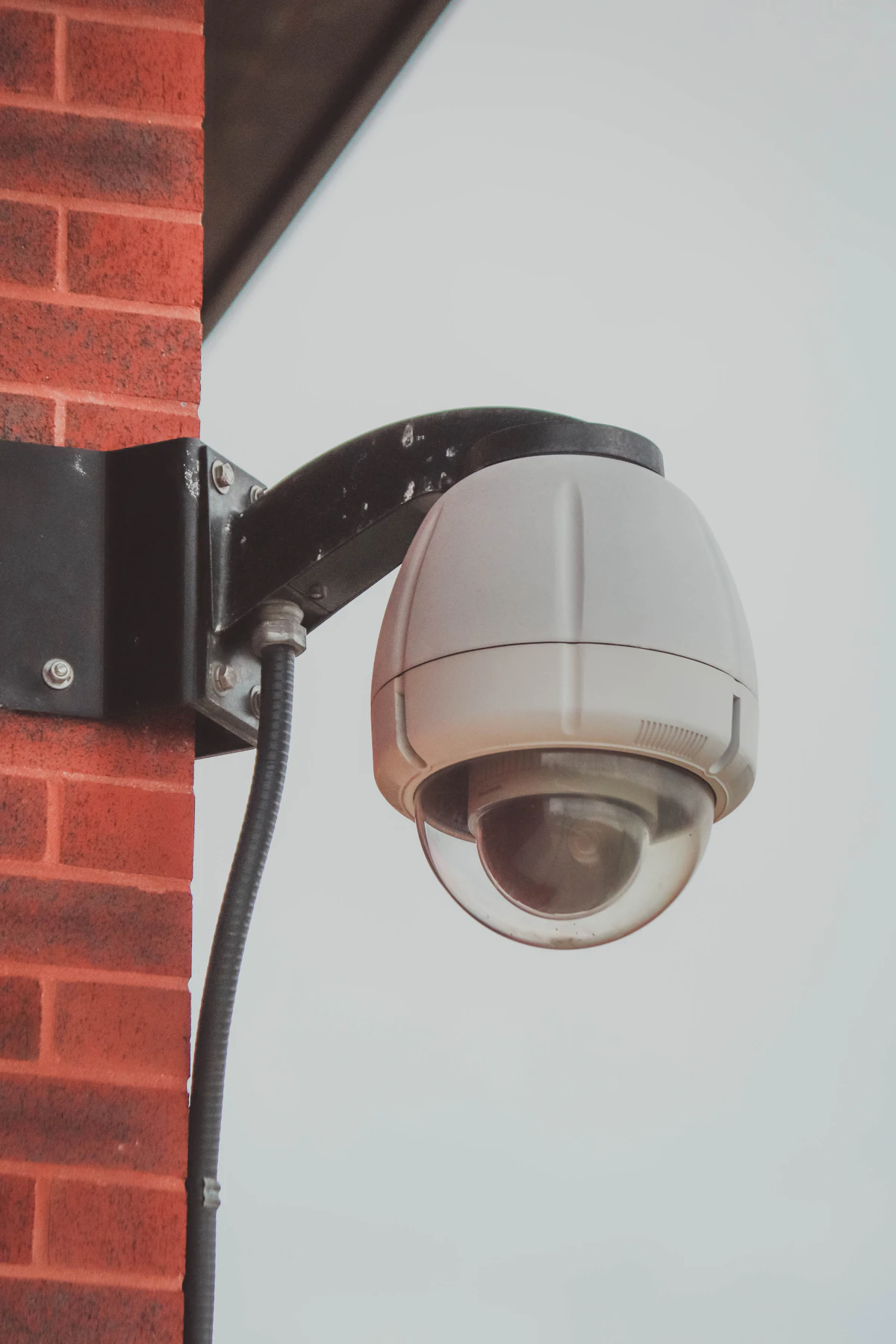 Security camera installed on a residential wall
