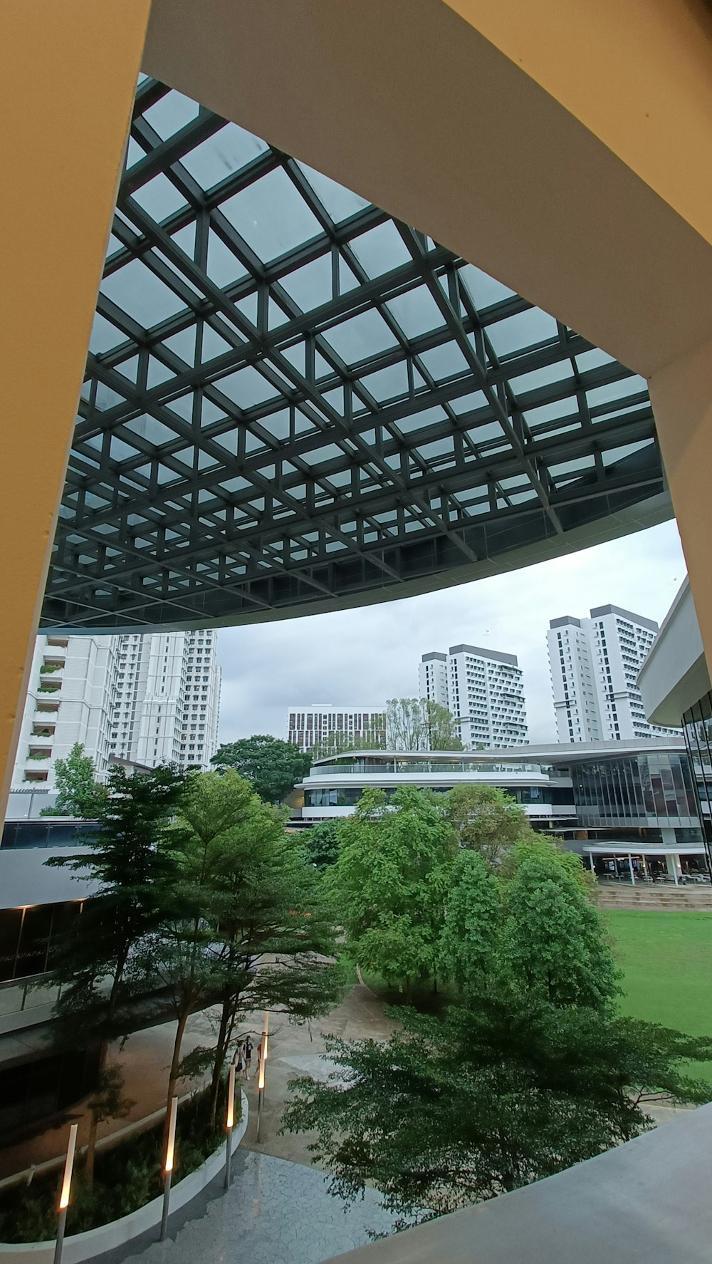 a view of a building from under a bridge