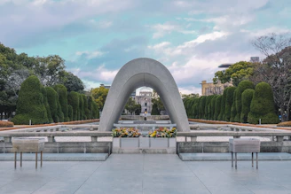 a large monument with benches in front of it