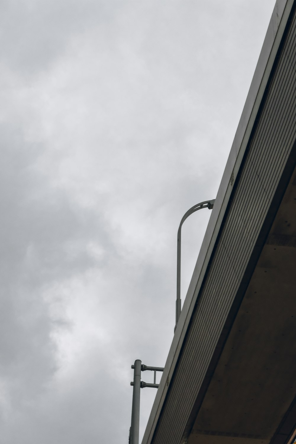 a bird is perched on the roof of a building