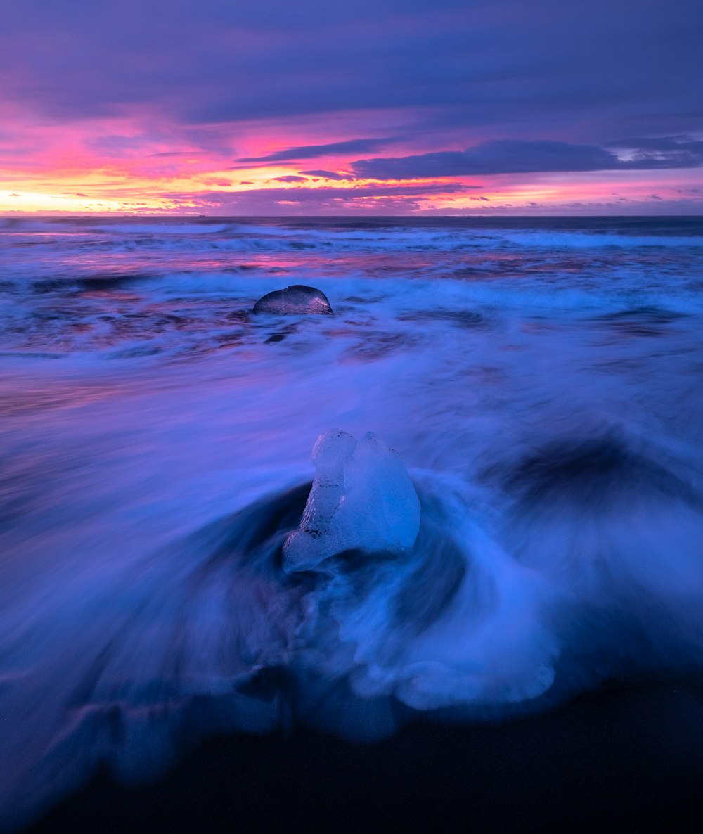 a blue and purple sunset over the ocean