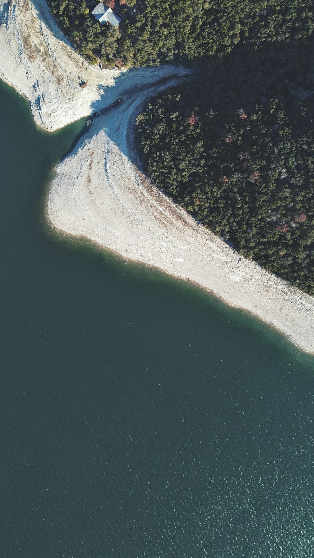 an aerial view of an island in the middle of a body of water