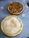 two pies sitting on top of a blue table cloth