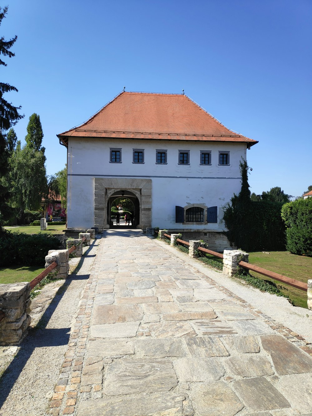 a large white building with a red roof