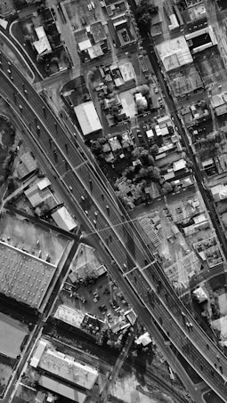 a black and white photo of an aerial view of a city