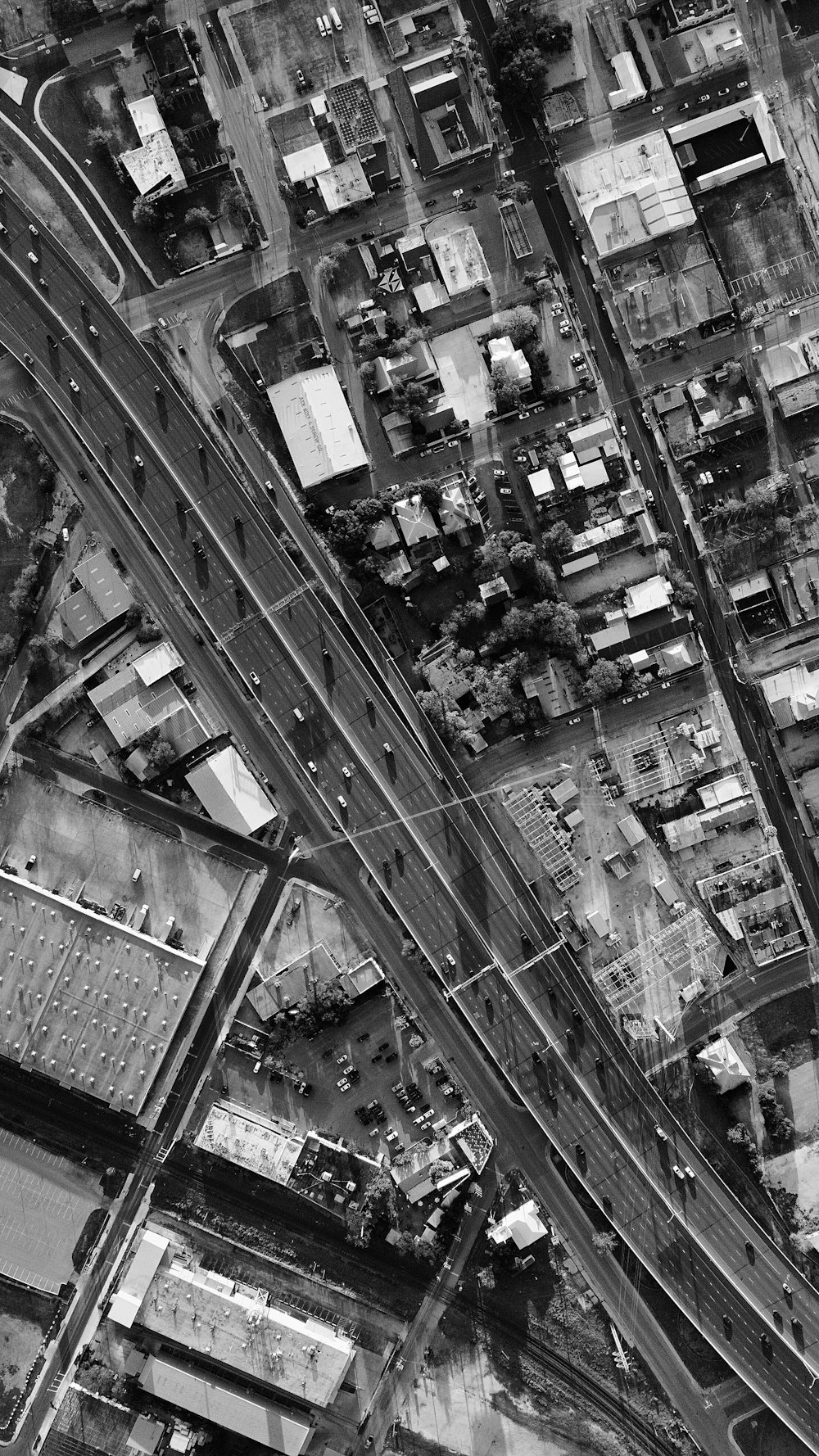 a black and white photo of an aerial view of a city
