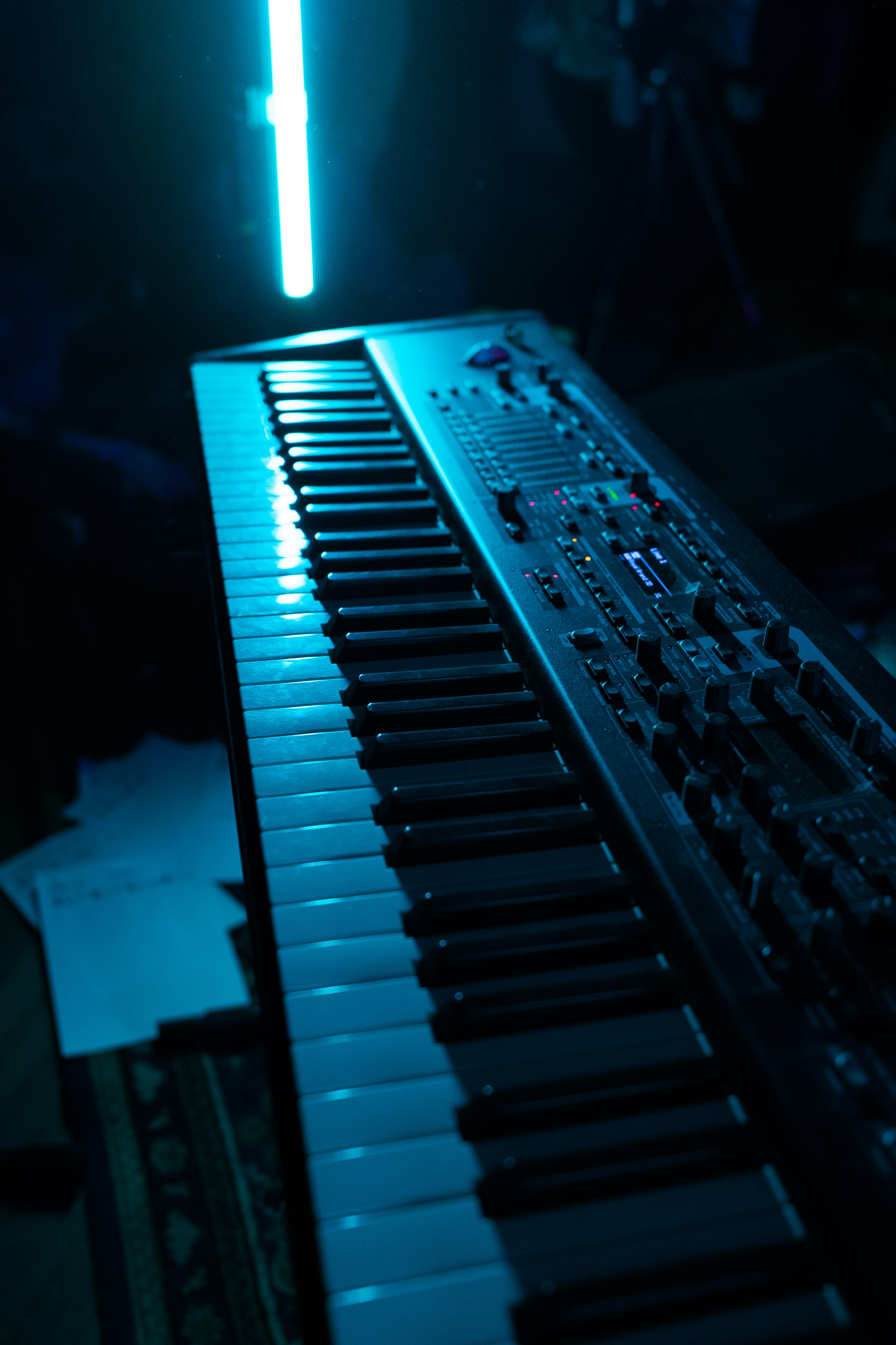 a close up of a keyboard in a dark room