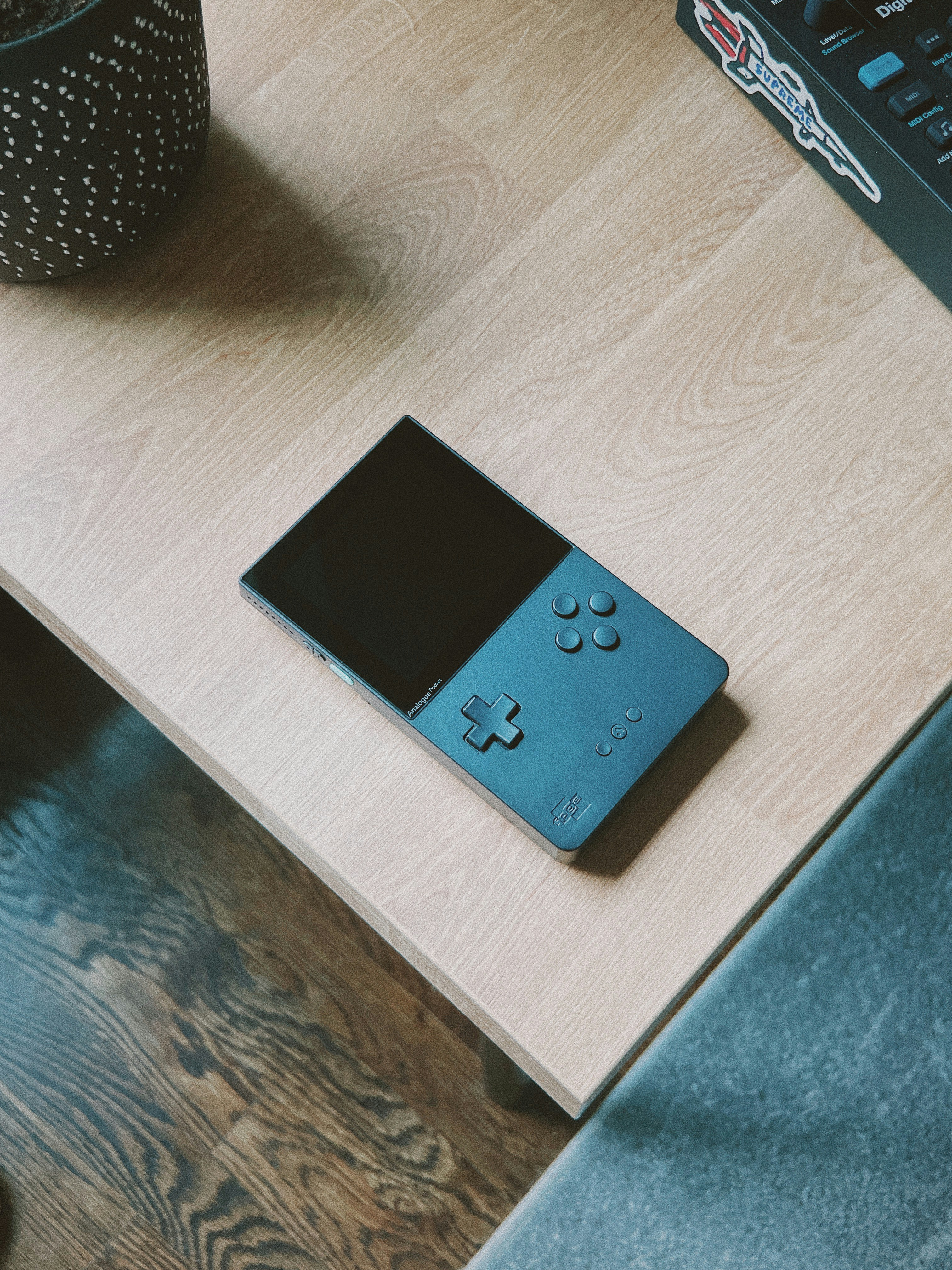 a nintendo wii sitting on top of a wooden table
