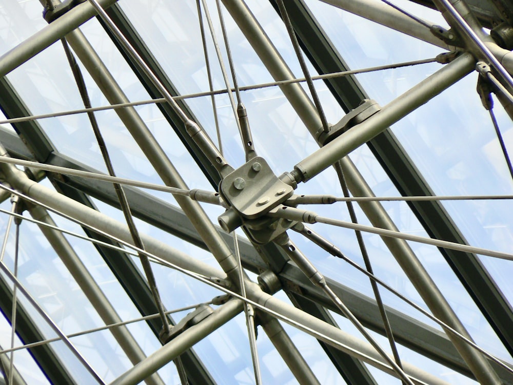 a close up of a metal structure with a sky background