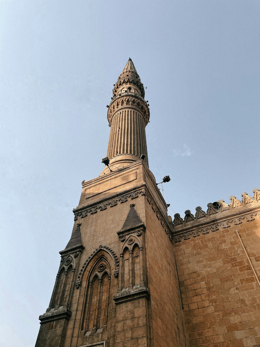 a very tall building with a clock on it's side