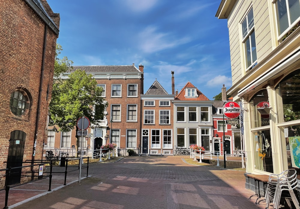 a street lined with tall brick buildings next to each other