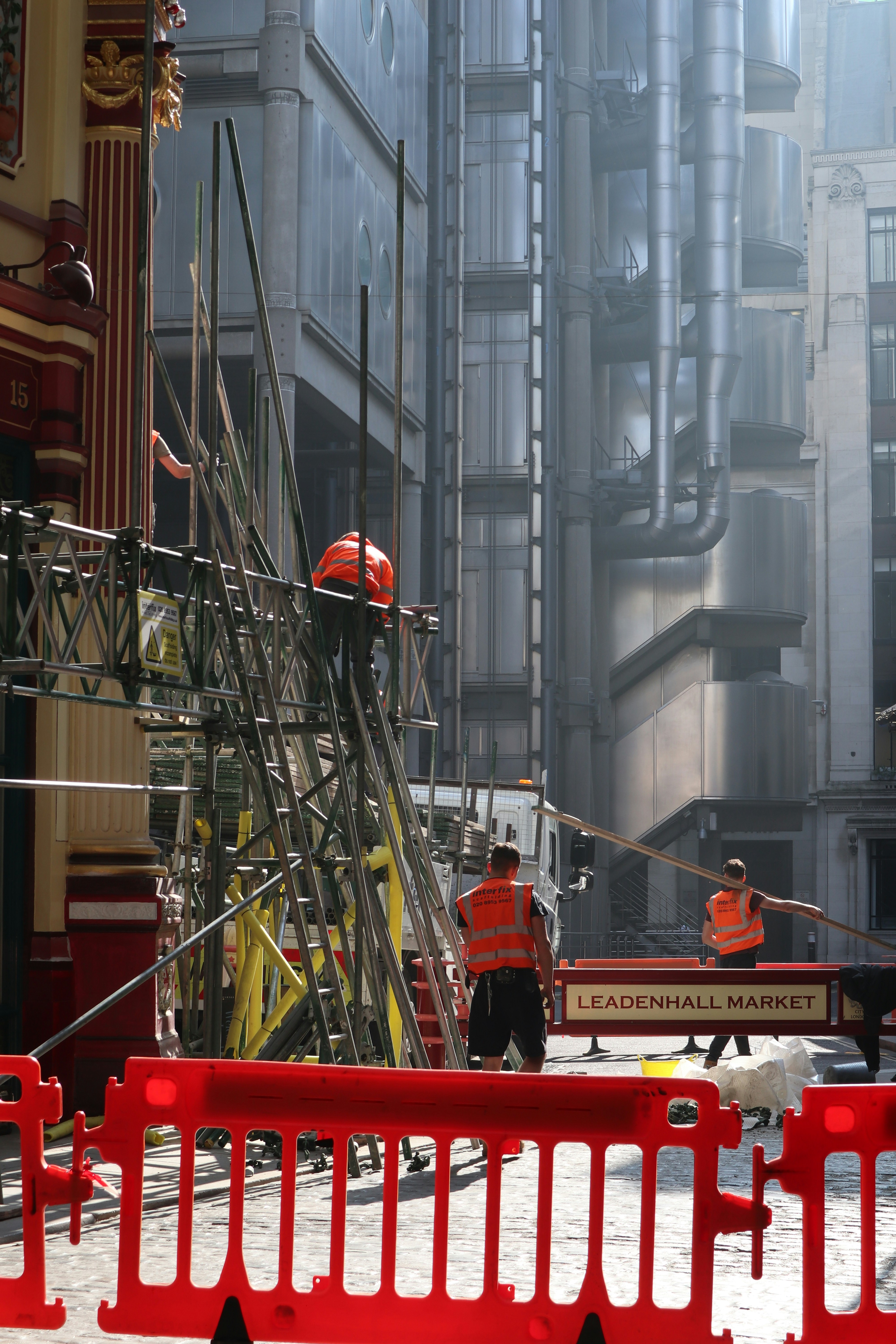 a construction site with workers and machinery in the background