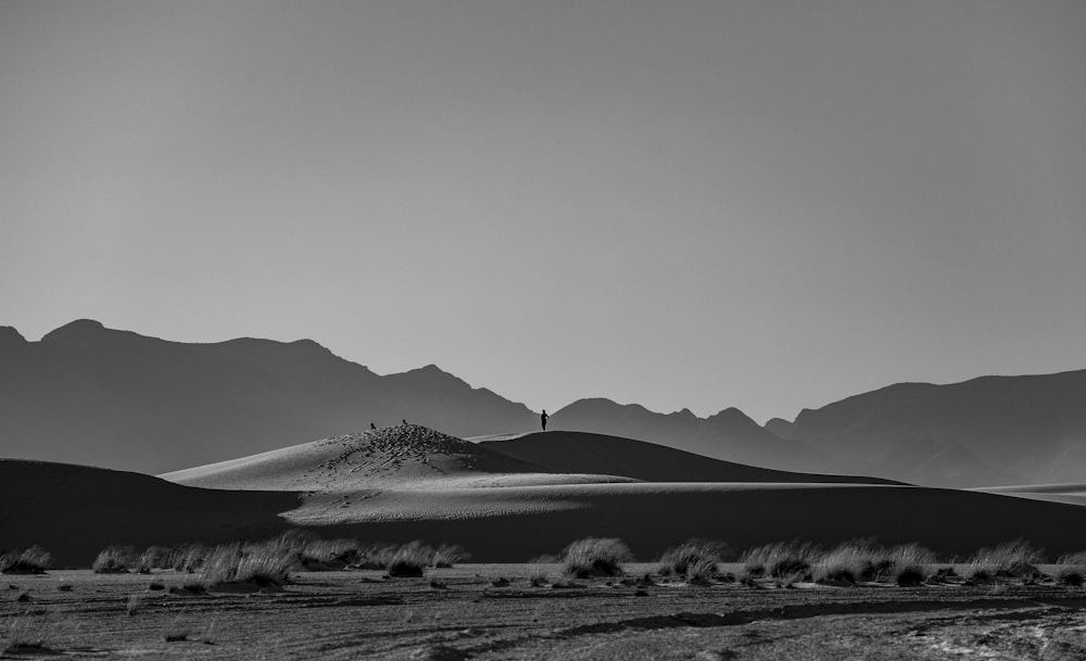 a black and white photo of a mountain range