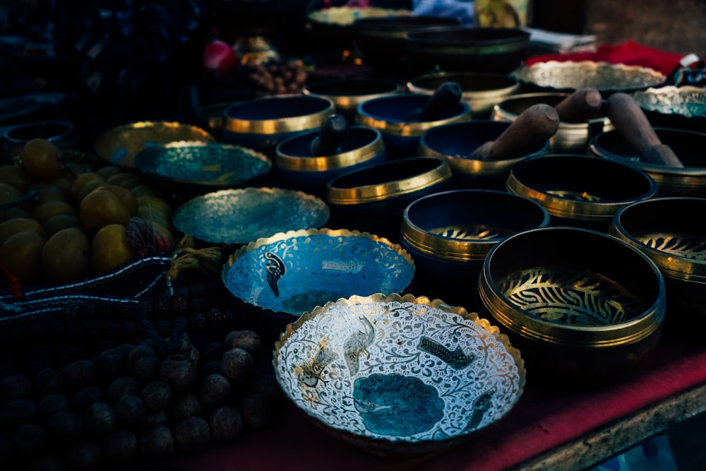 a table topped with lots of bowls filled with food