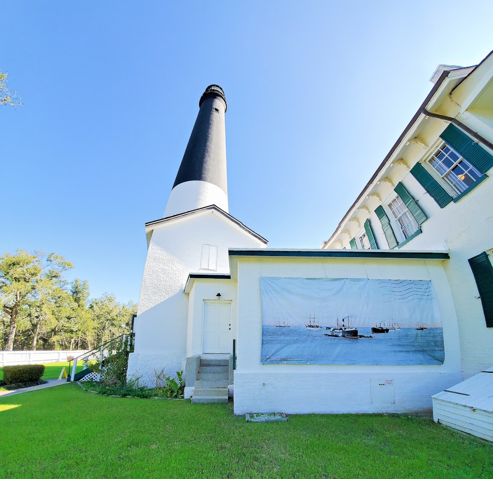 a picture of a lighthouse on the side of a building