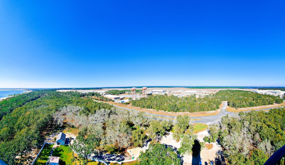 an aerial view of a parking lot near a lake