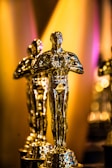 a number of oscar statues on a table