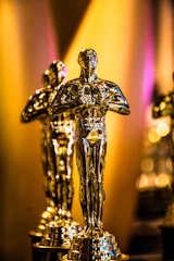 Golden statuette gleaming against a black velvet backdrop.