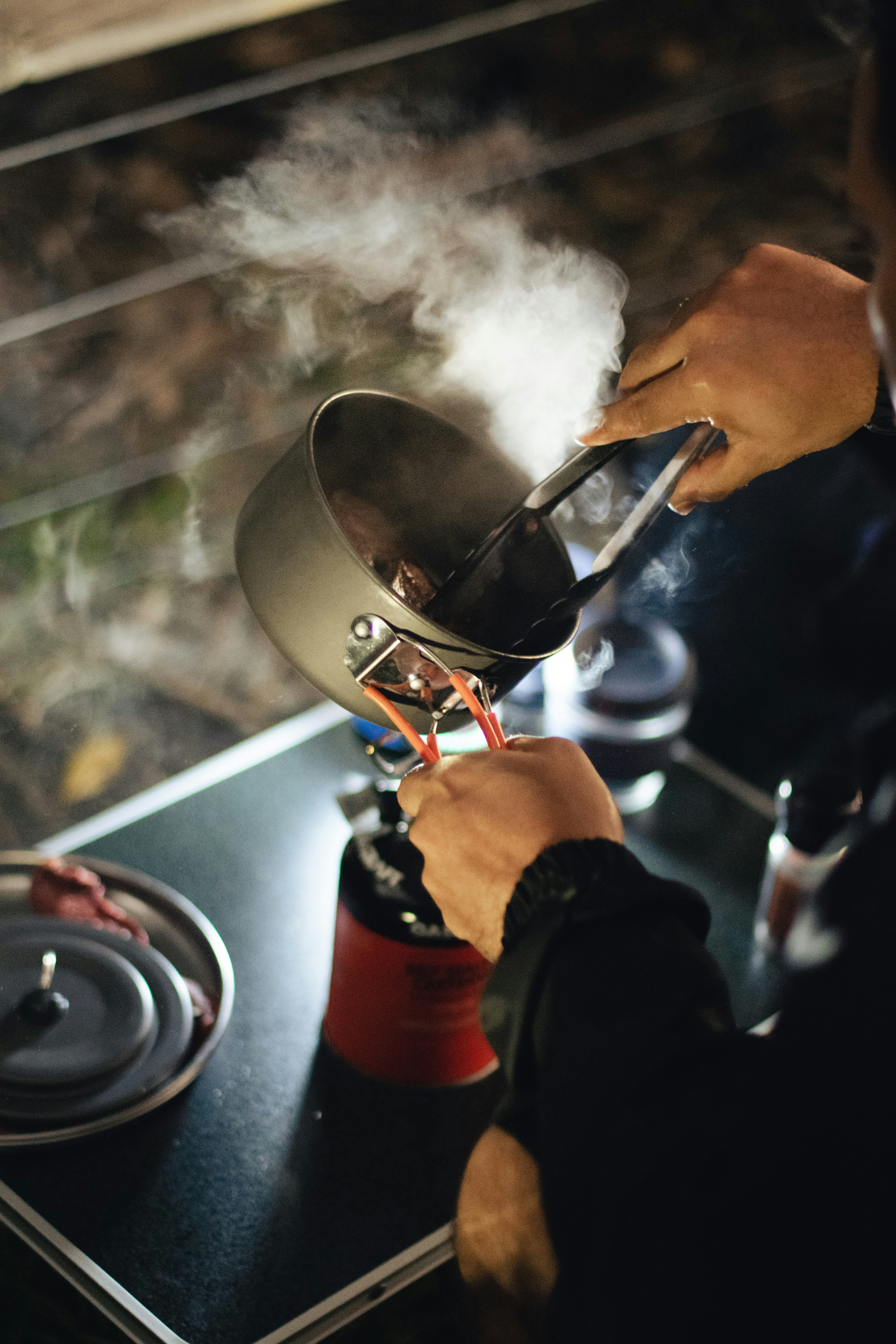 a person is cooking on a stove top