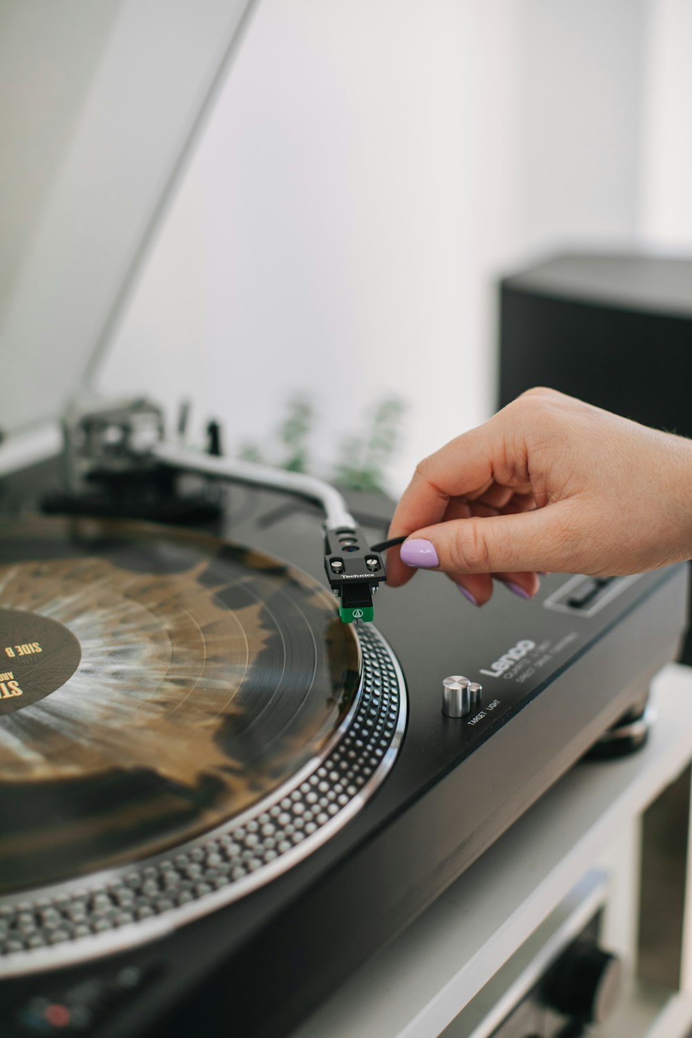 a person is playing on a record player