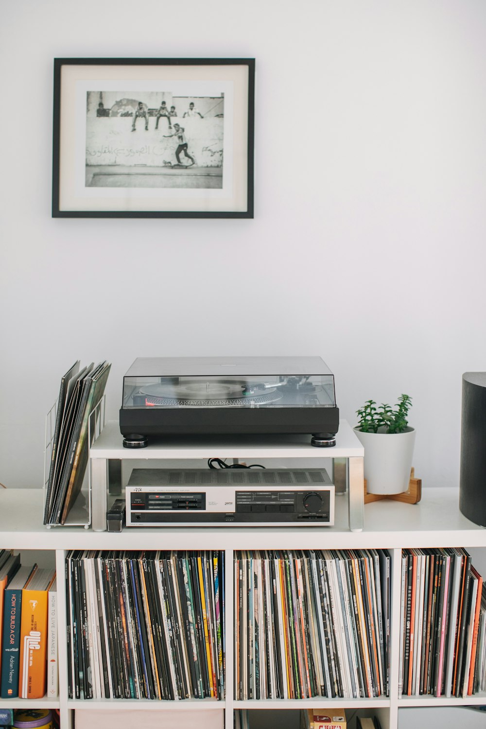 a white entertainment center with a dvd player on top of it