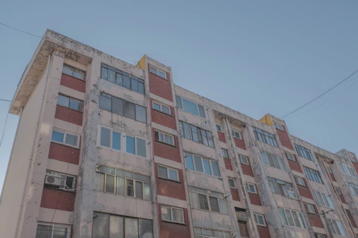Modern residential building with visible electrical and plumbing installations.