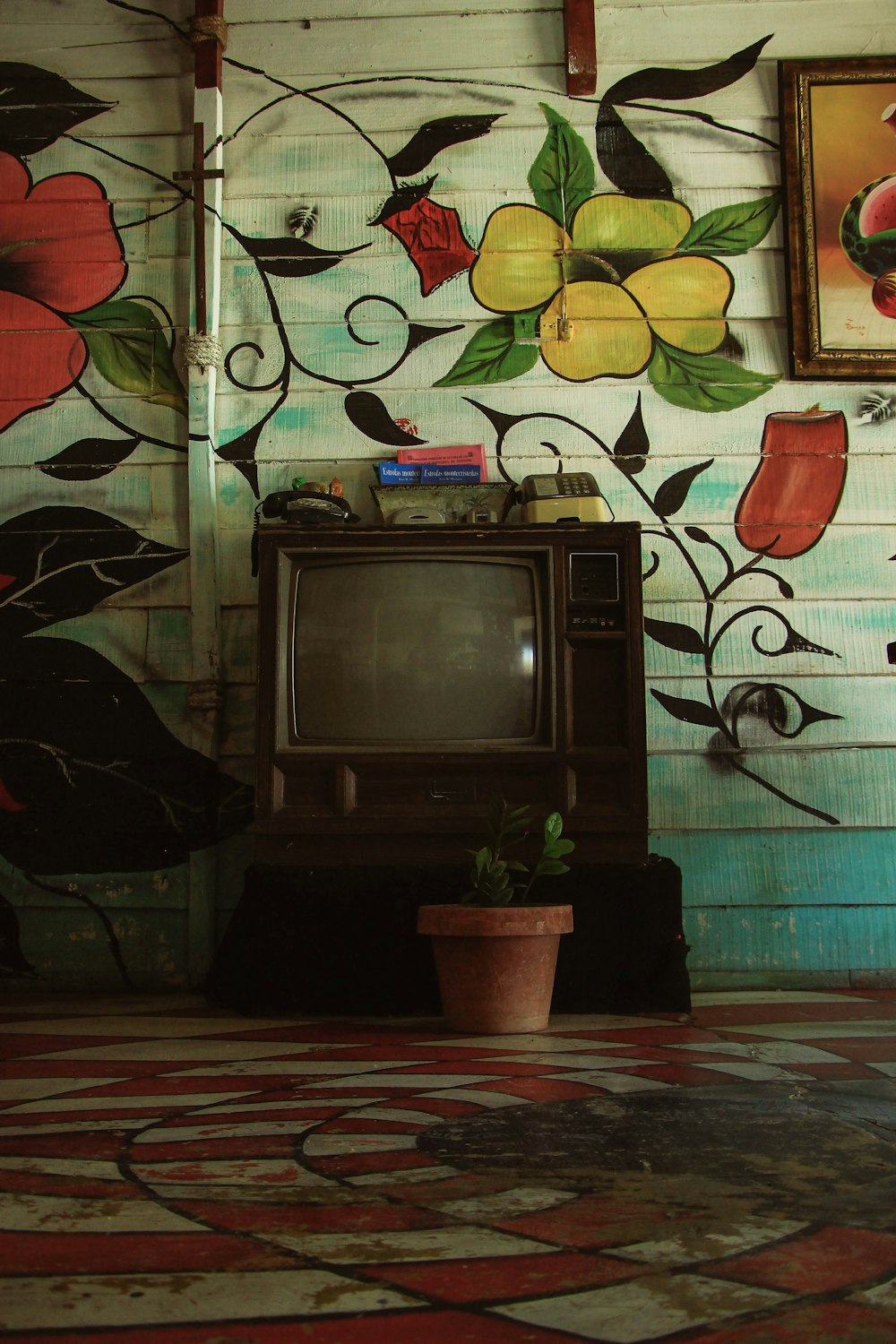 a tv sitting on top of a wooden table