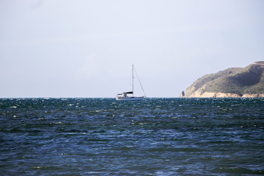 a sailboat in the middle of a large body of water