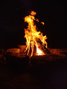 a fire is lit in the dark with bright flames