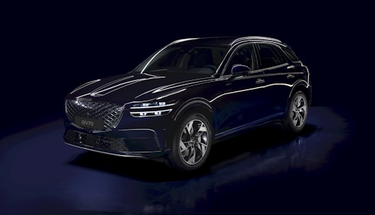 a blue car is shown in a dark room