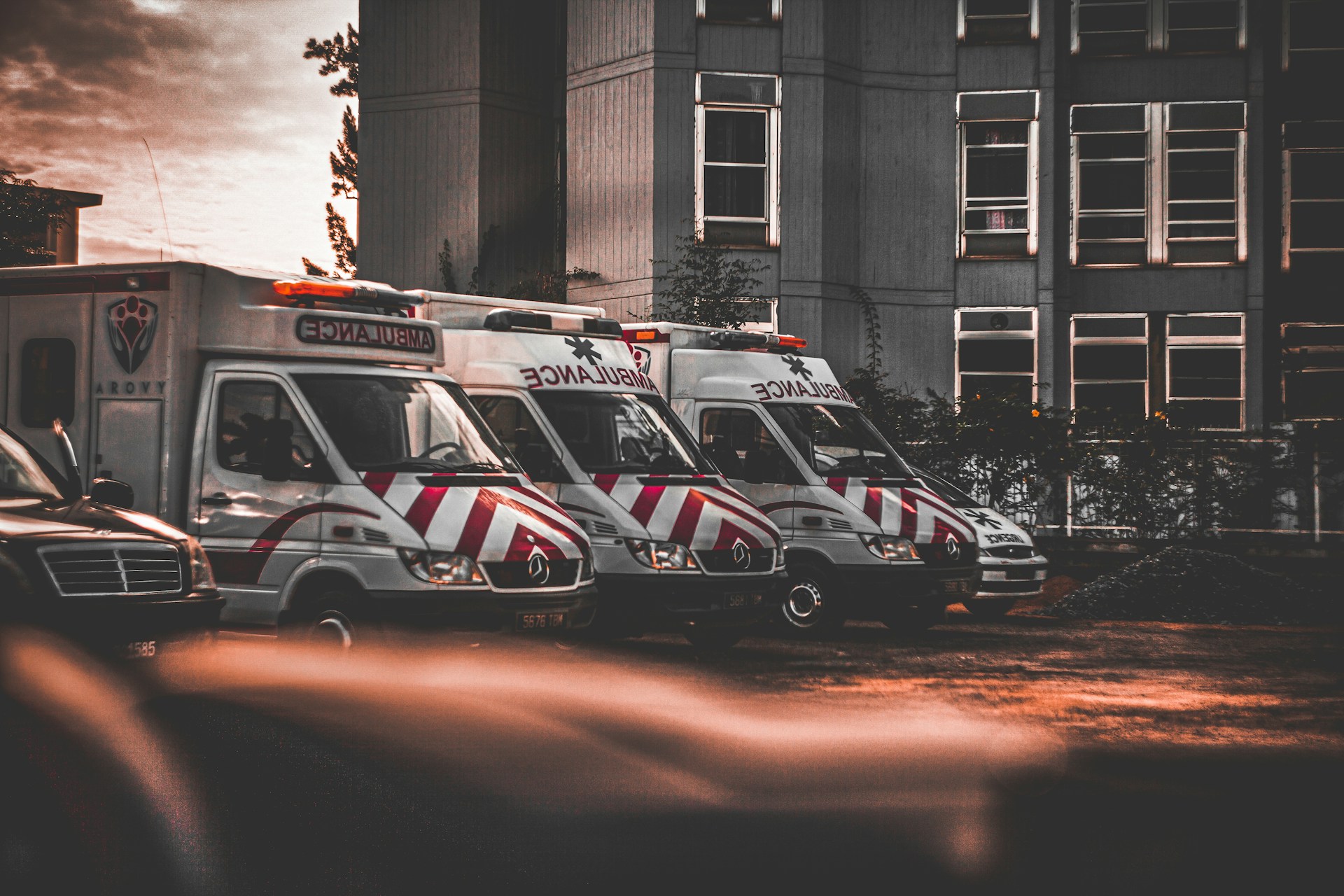 a row of ambulances parked in a parking lot
