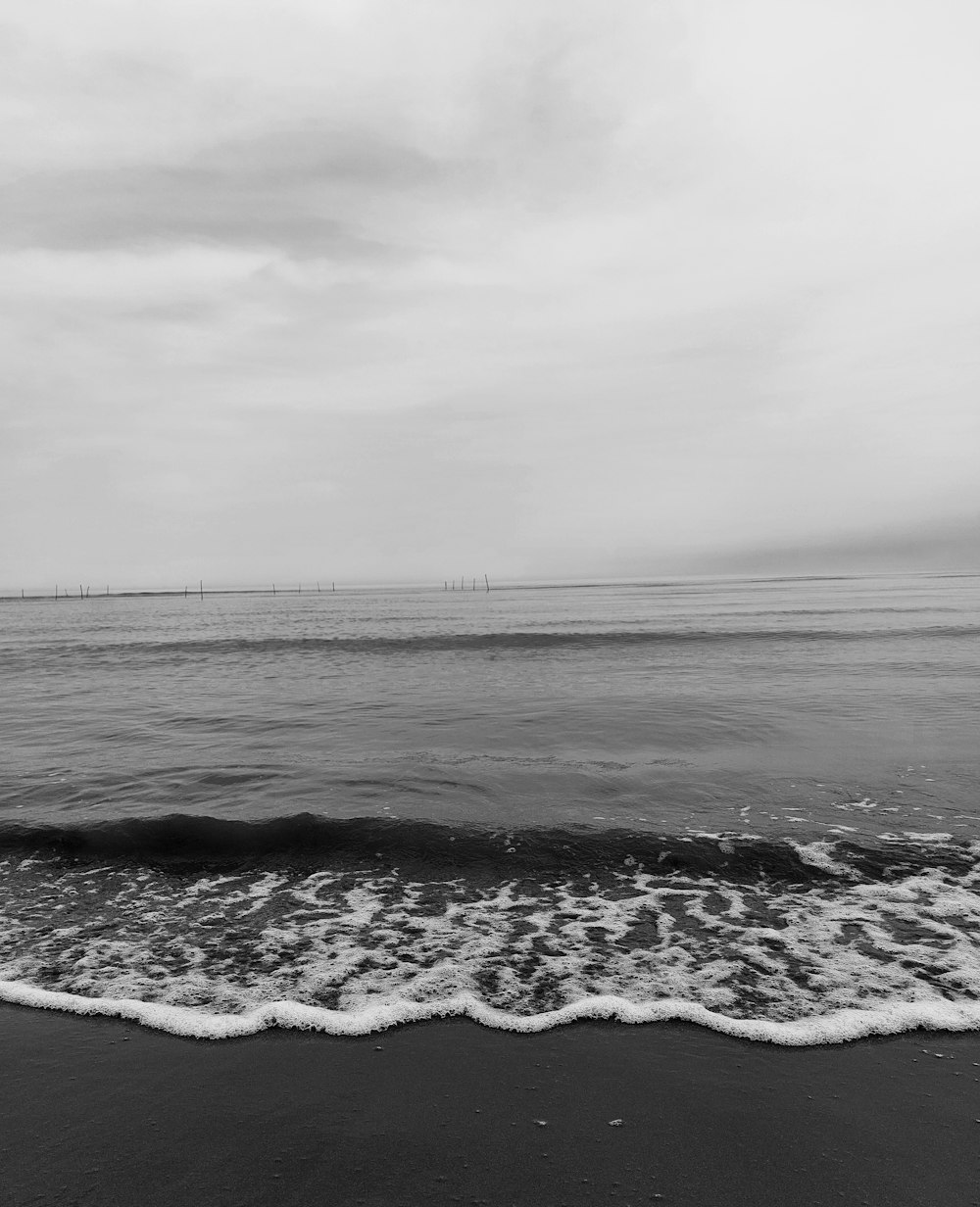 a black and white photo of the ocean