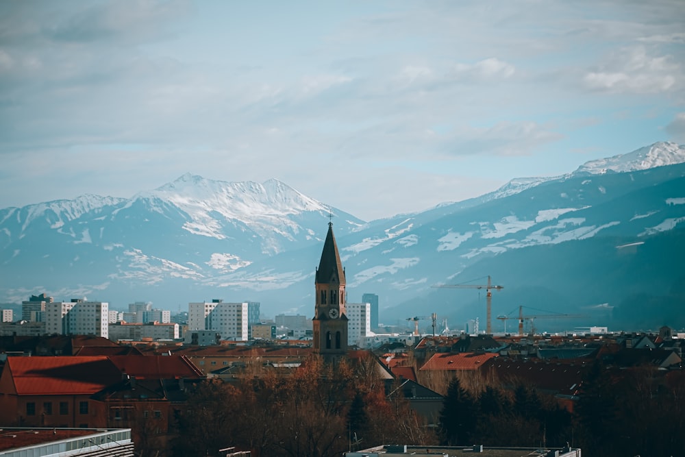 a view of a city with mountains in the background