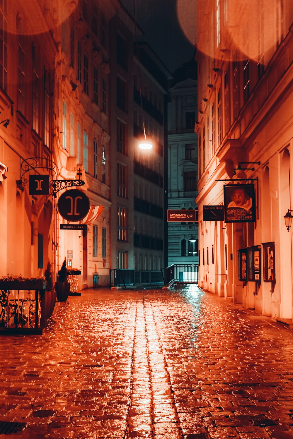 a city street at night with a street light on