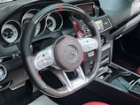 Close-up of a luxury car dashboard with illuminated digital displays.