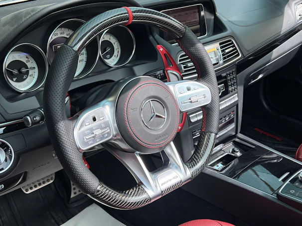 Close-up of a luxury car's dashboard highlighting advanced technology and craftsmanship.