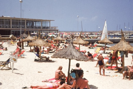a crowded beach filled with lots of people